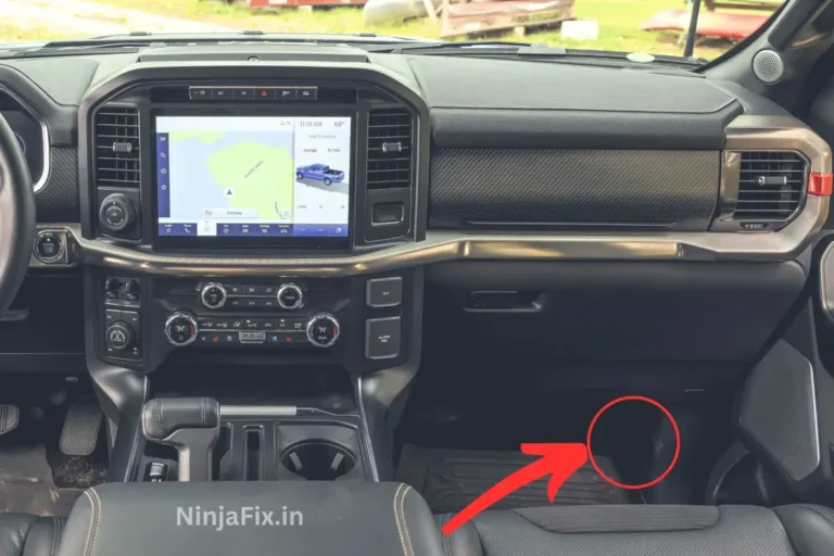 pic of ford f150 cabin with red circle and arrow to showcase the location of under dash fuse box location of 2023 ford f 150