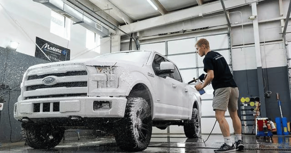 a pic of Ford f 150 covered with foam washing by a its owner to show case tips for interior and exterior care of ford f 150