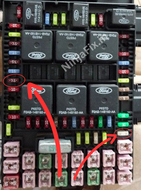 Photo of 2006 ford f 150 fuse box with red marking to highlights fuse location related to radio  